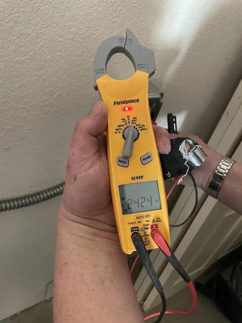 Voltage testing with clamp meter during Aluminum Wiring Replacement in Estelle